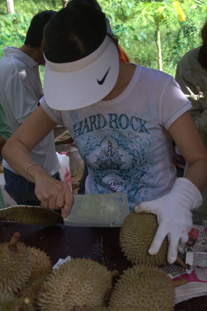 Trying to open a durian